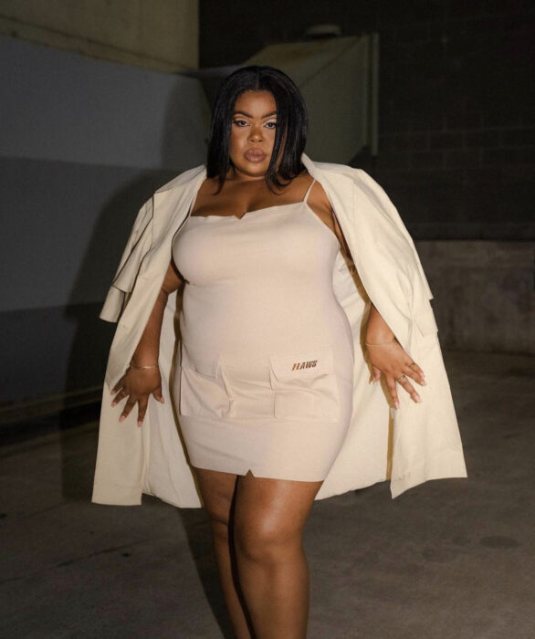 cream colored knit mini dress with matching cream trench coat
