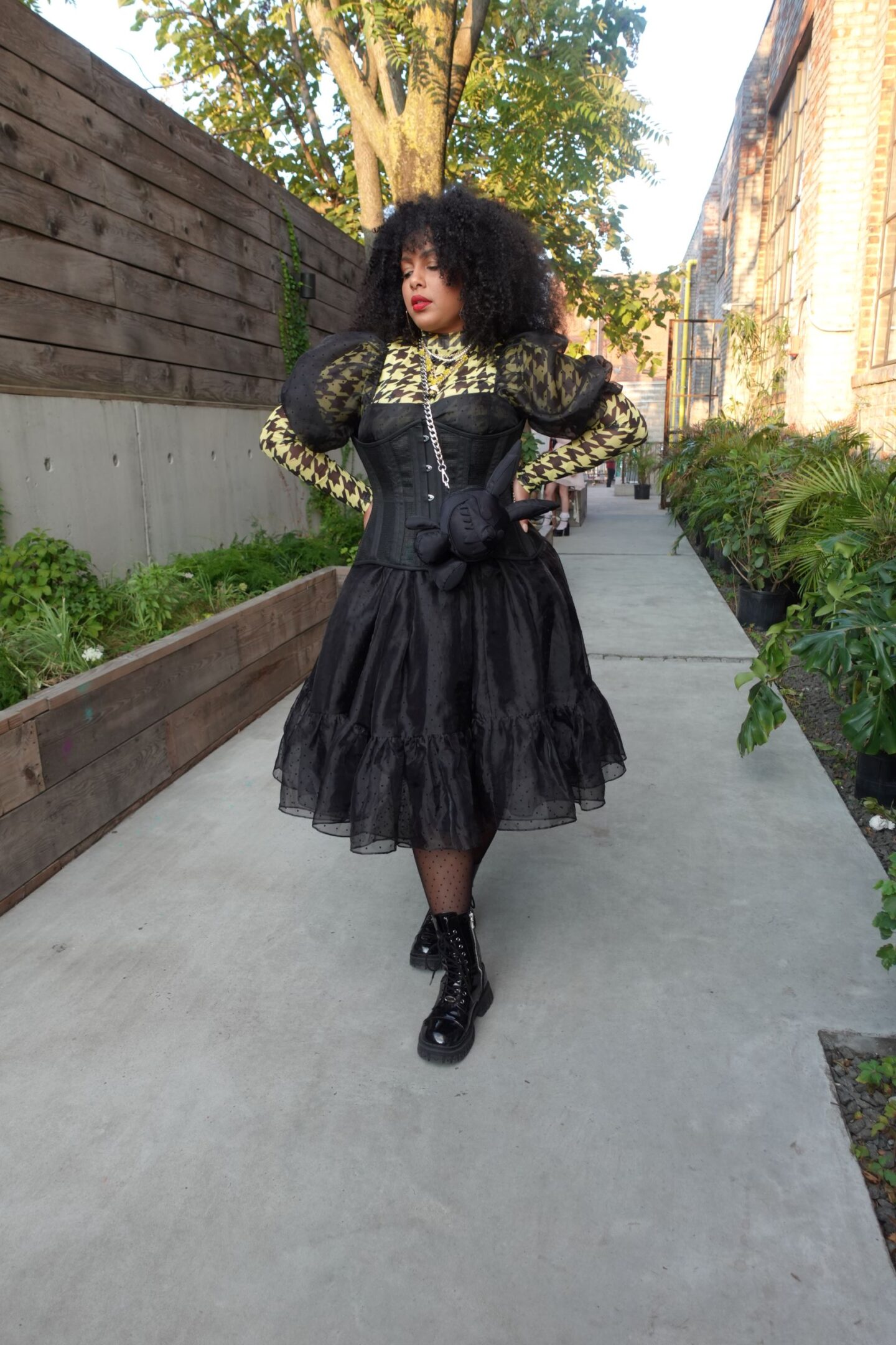 curvy woman in a black corseted dress from selkie