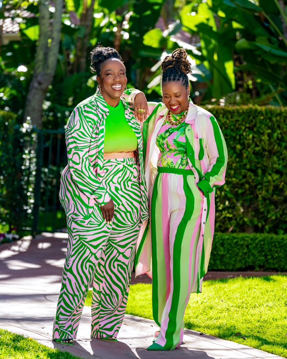 a colorful tropical scene with
dressed in joy x britta tabor plus size collection