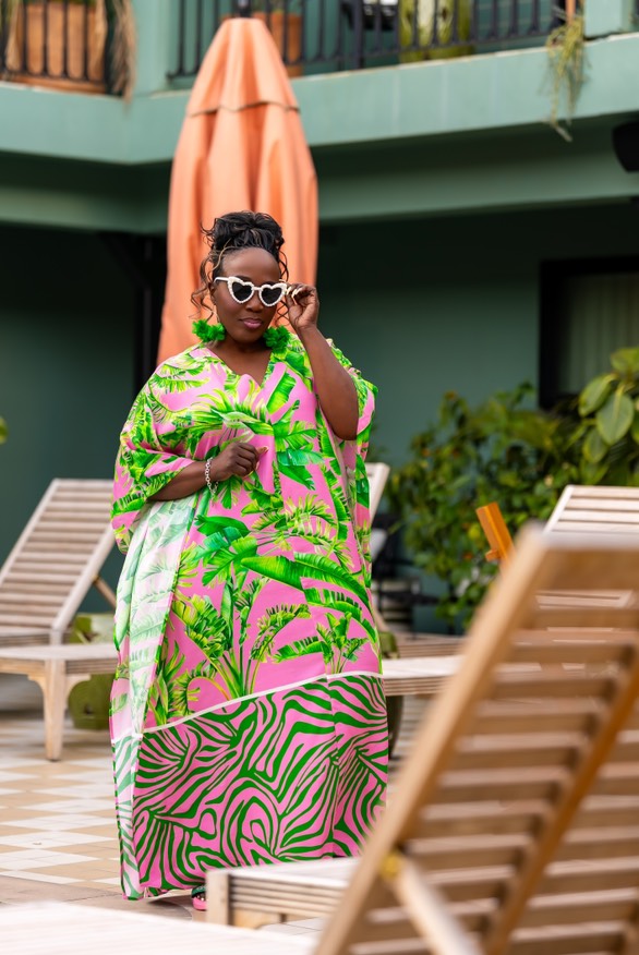 a pool vacation scene
dressed in joy x britta tabor plus size collection